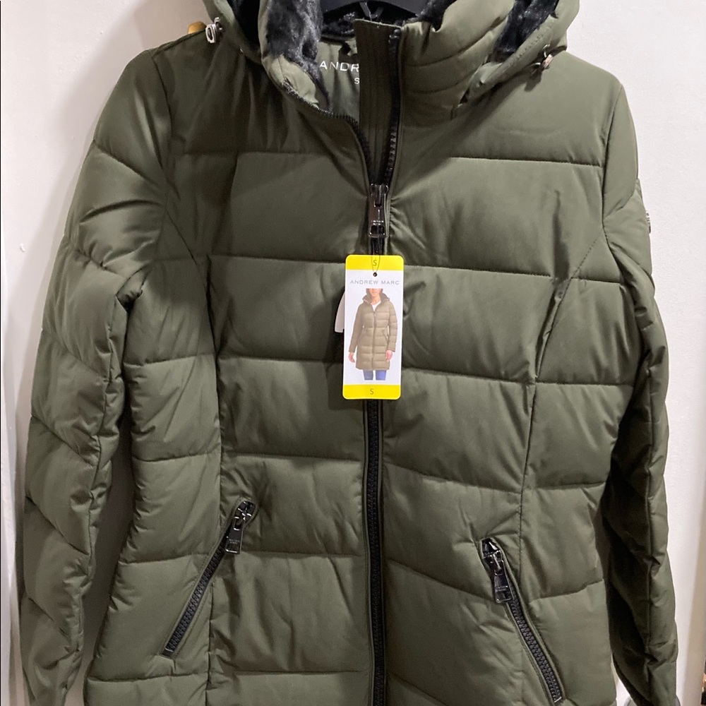 Brand new Andrew Marc woman jacket with tags. Pockets and fur-lined hood.